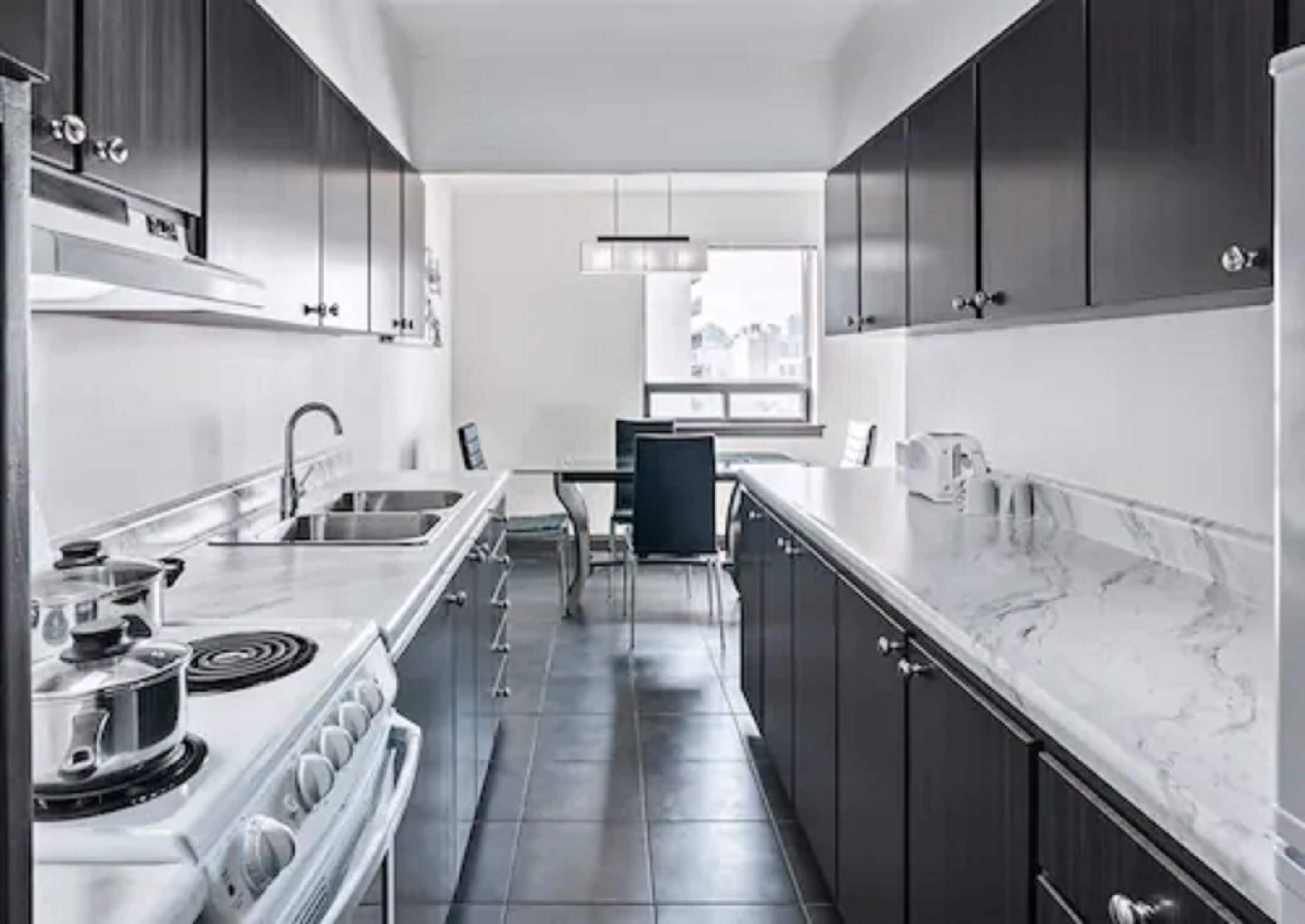 Executive Suite, 1 King Bed with Sofa bed | Private kitchen | Coffee/tea maker