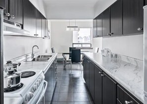 Executive Suite, 1 King Bed with Sofa bed | Private kitchen | Coffee/tea maker