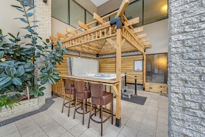 Indoor pool, open 8:00 AM to 10:00 PM, pool loungers