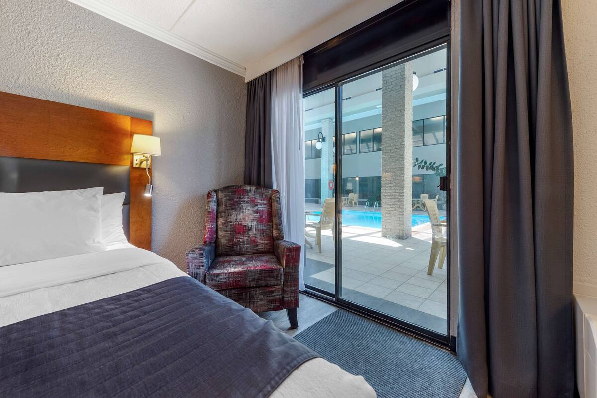 memory-foam beds, desk, laptop workspace, blackout curtains