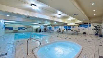 Indoor pool, open 7:00 AM to 11:00 PM, pool loungers