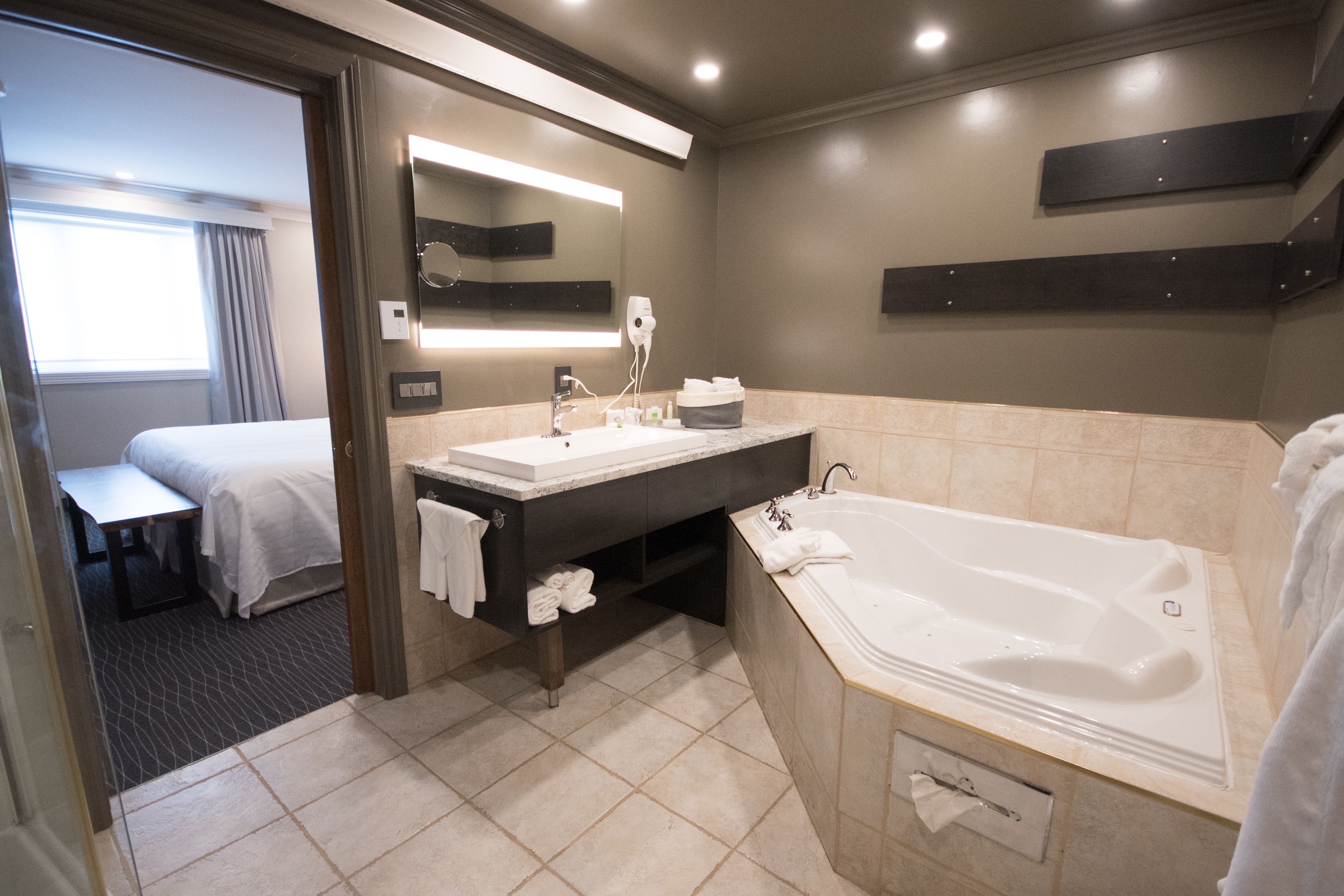 presidential suite, 1 king bed, jetted tub (multi-jet shower) | bathroom amenities | free toiletries, hair dryer, bathrobes, towels