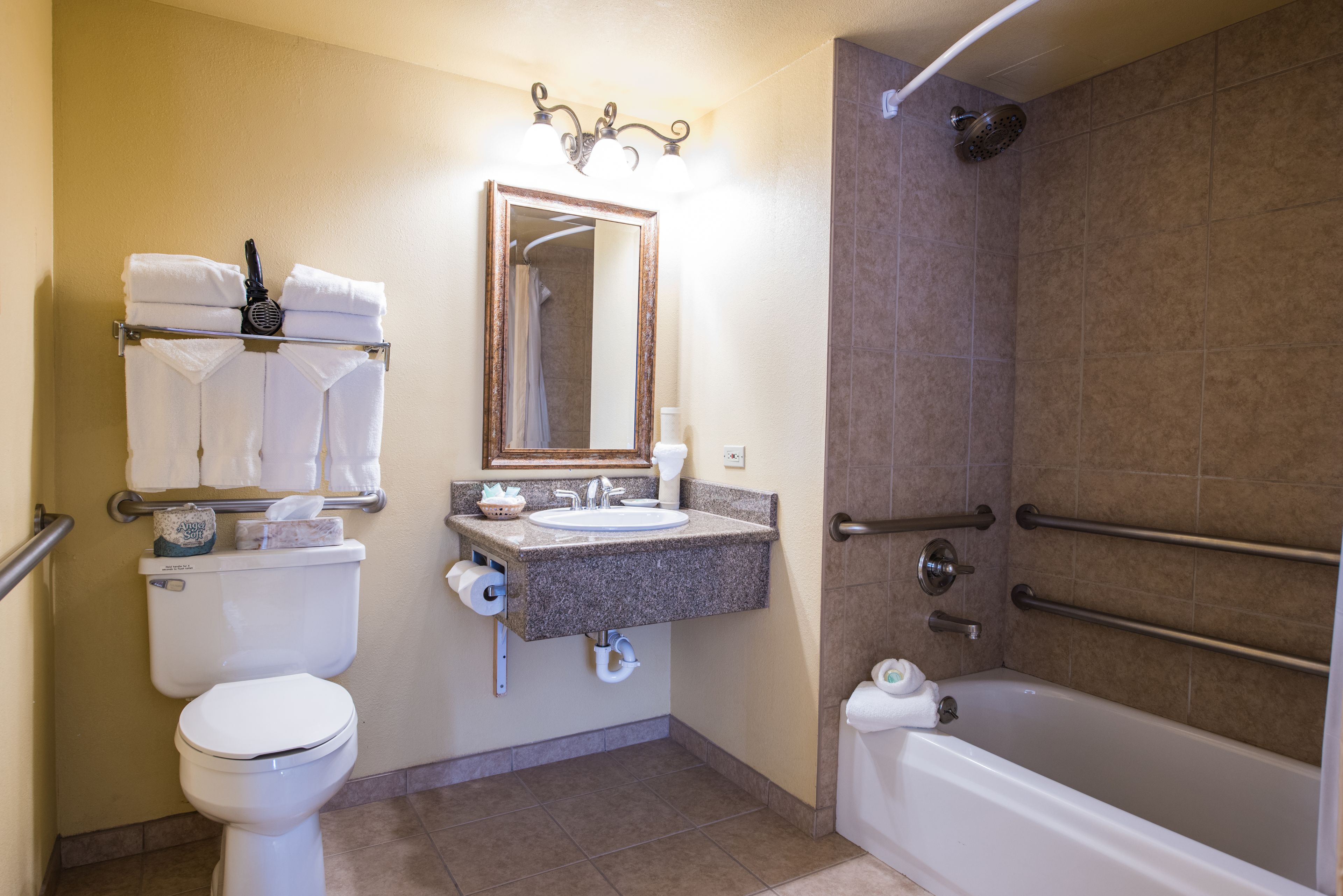 Combined shower/bathtub, designer toiletries, hair dryer, towels