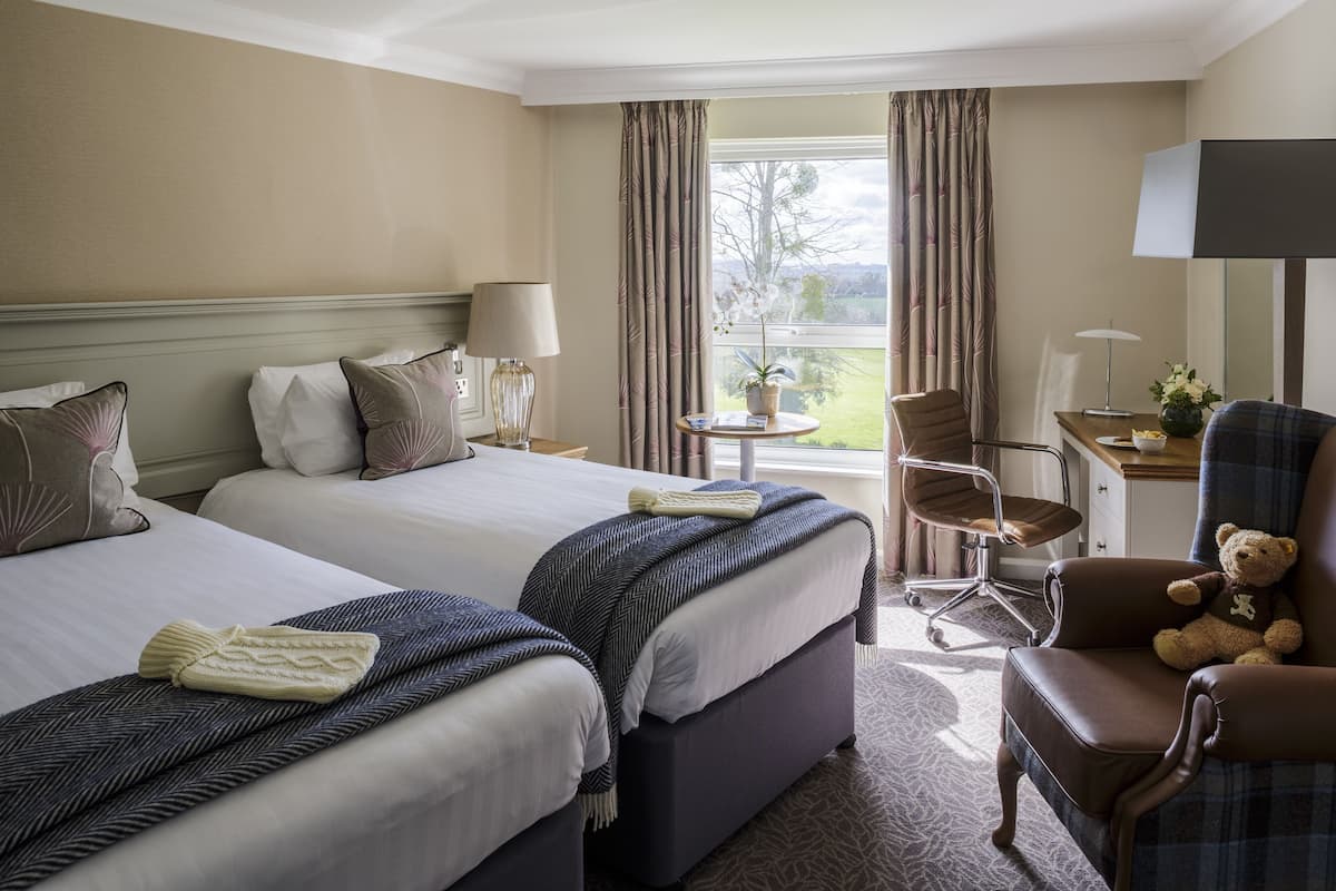 standard double or twin room, golf view | hypo-allergenic bedding, in-room safe, desk, iron/ironing board