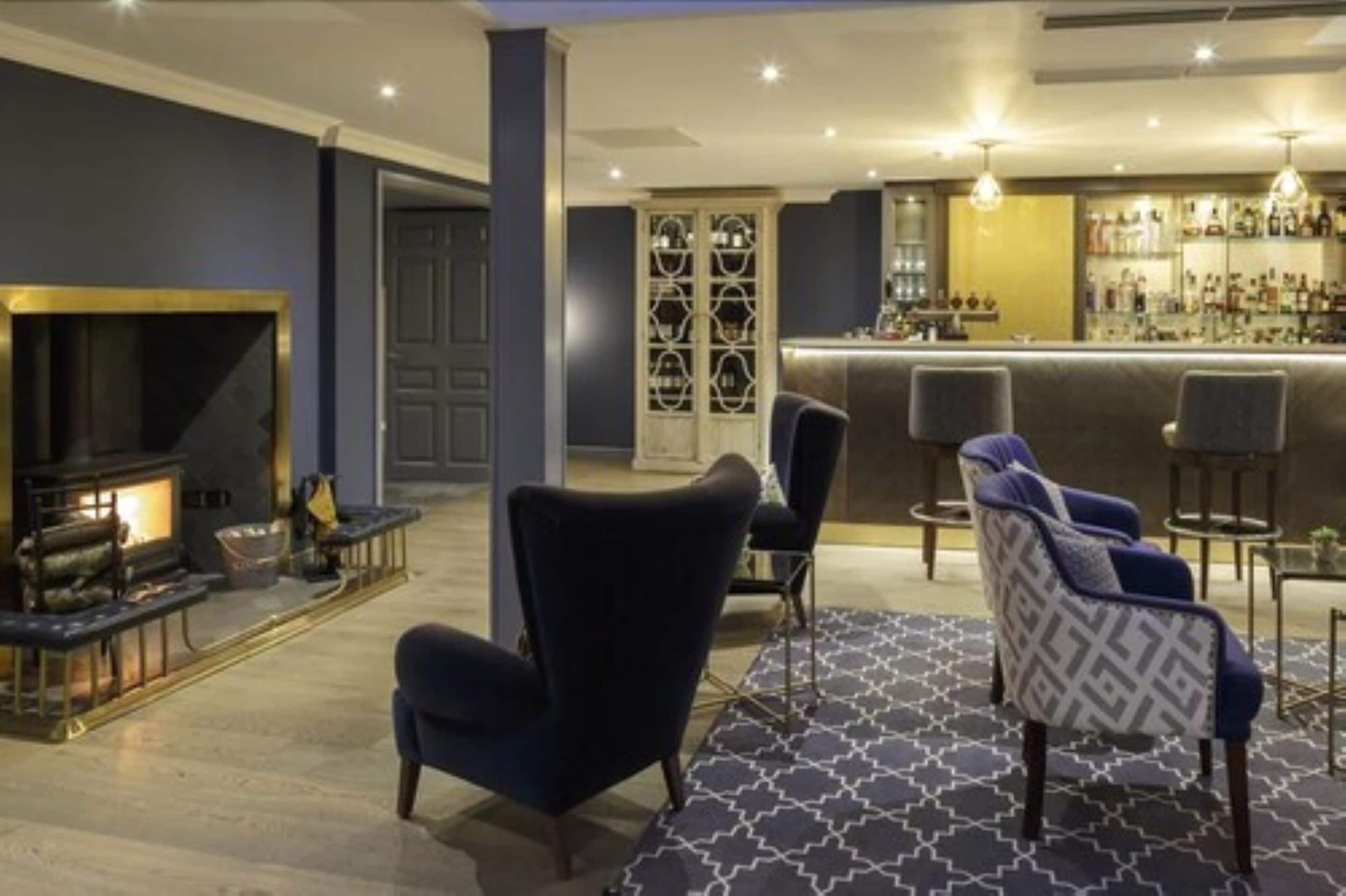 A bar area with a counter and seating.
