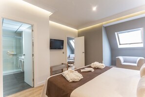 Suite Junior | Draps en coton égyptien, literie de qualité, minibar, coffre-fort
