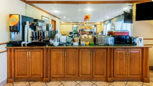 A kitchen with a wooden counter, coffee machines, a microwave, and various appliances. - La Quinta Inn & Suites by Wyndham Las Cruces Organ Mountain (Las Cruces)