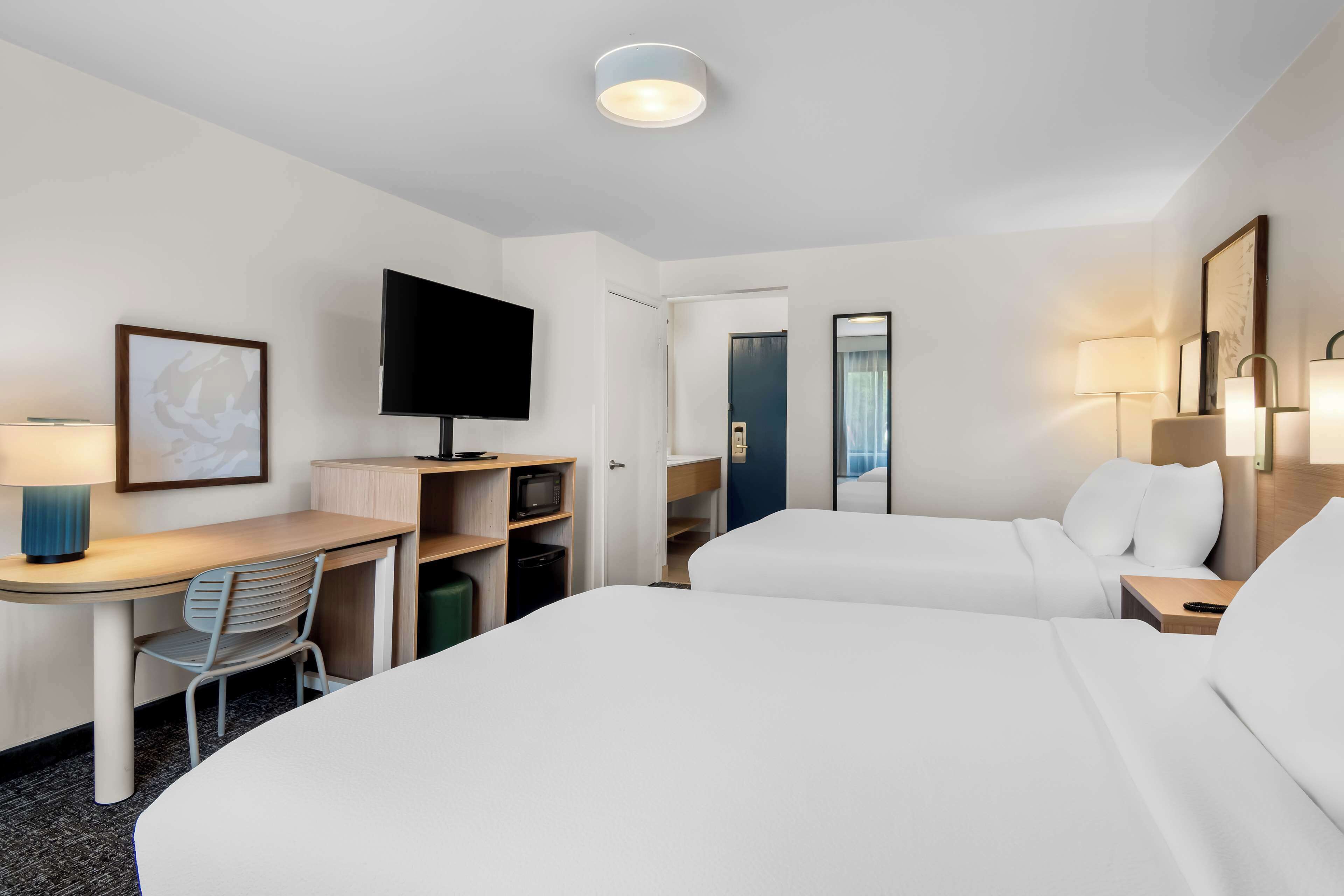 room, 2 queen beds | desk, laptop workspace, iron/ironing board, free rollaway beds