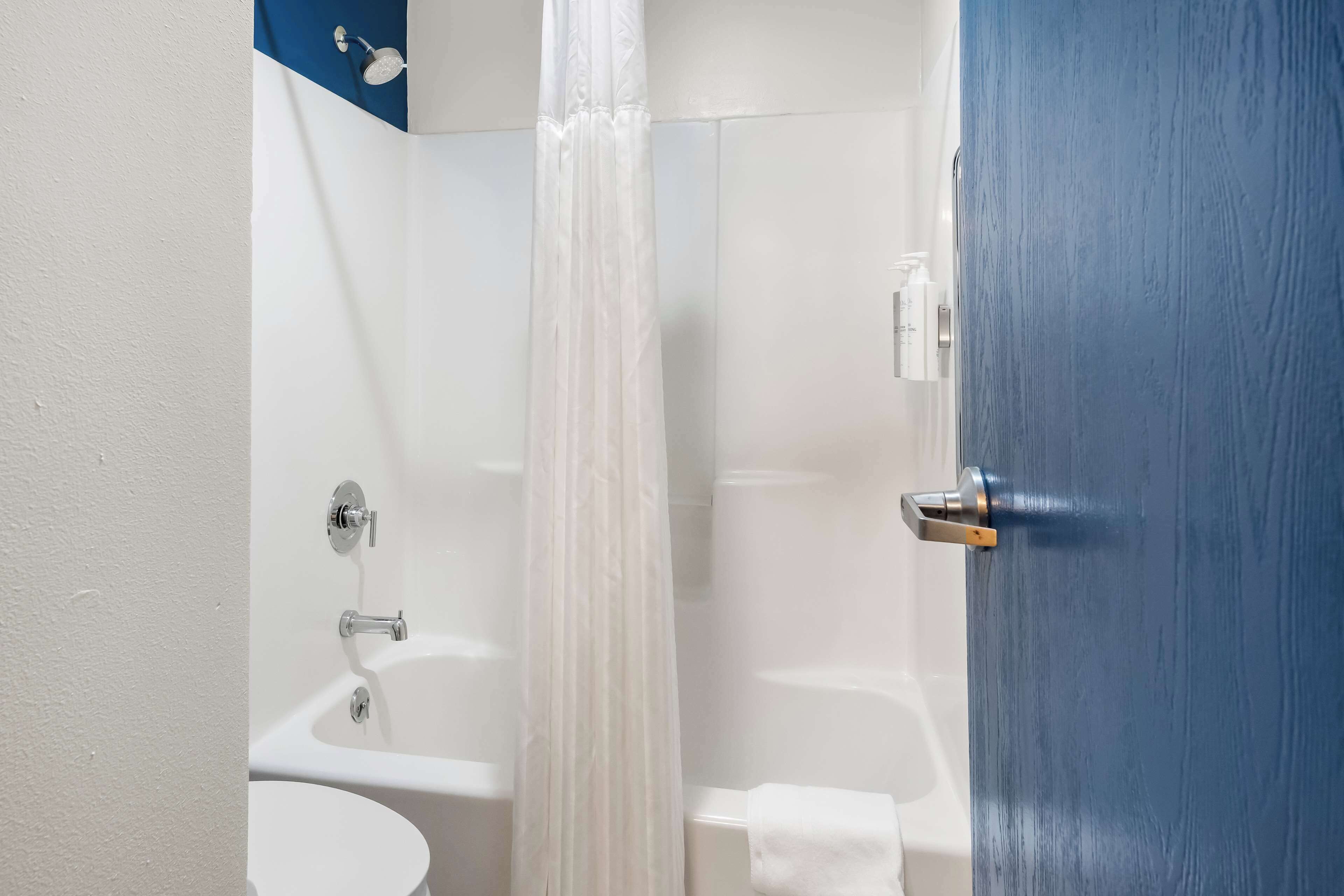 room, 2 queen beds | bathroom | free toiletries, hair dryer, towels, soap