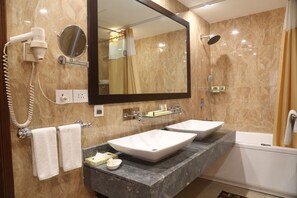 Combined shower/tub, rainfall showerhead, designer toiletries - The Ashok (New Delhi)