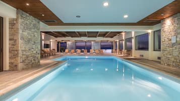 Indoor pool, open 10:00 AM to 9:00 PM, pool loungers