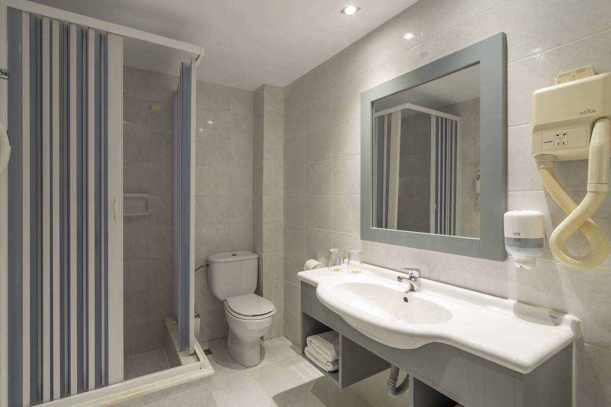 free toiletries, hair dryer, slippers, towels