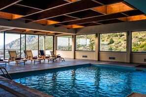 Indoor pool, open 10:00 AM to 9:00 PM, pool loungers