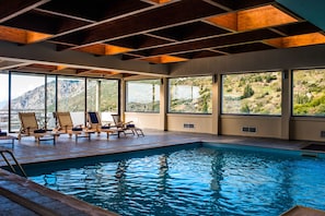 Indoor pool, open 10:00 AM to 9:00 PM, pool loungers