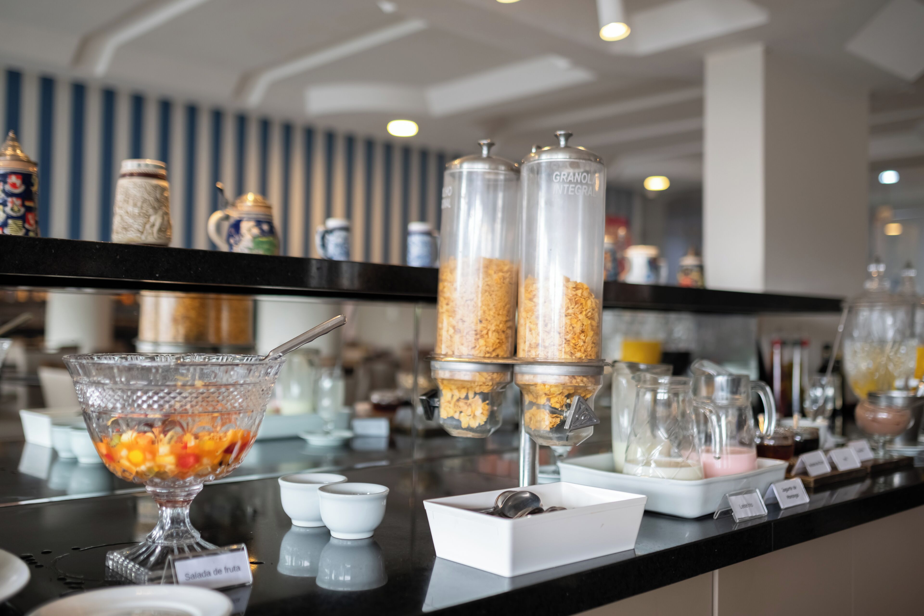 A breakfast buffet with various food items and containers.
