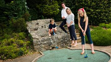 Guests can enjoy a game of croquet on the well-maintained lawn.