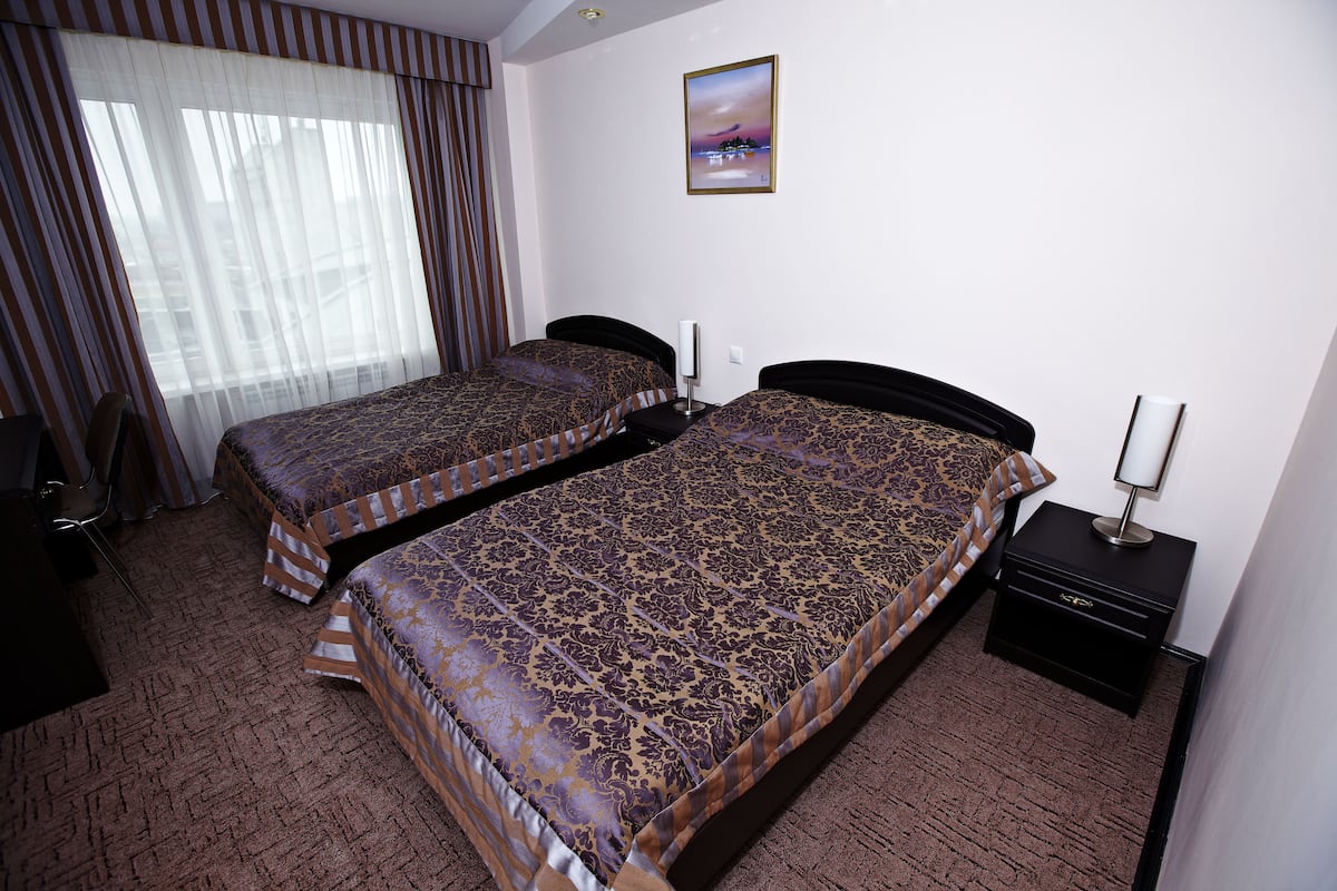 Luxury Suite, 2 Twin Beds | In-room safe, desk, iron/ironing board, free cribs/infant beds