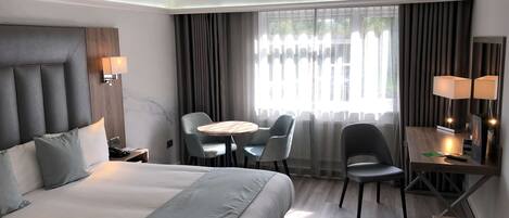 Deluxe Room, 1 King Bed, Non Smoking (Converts to 2 Twin Beds) | Desk, laptop workspace, iron/ironing board, free WiFi