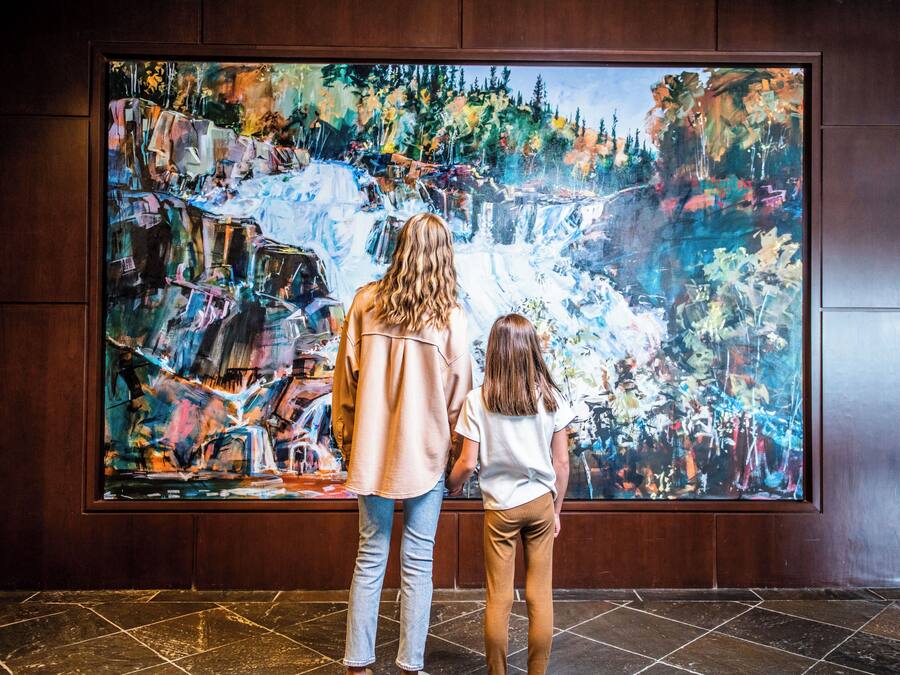 A large abstract painting on a wall.