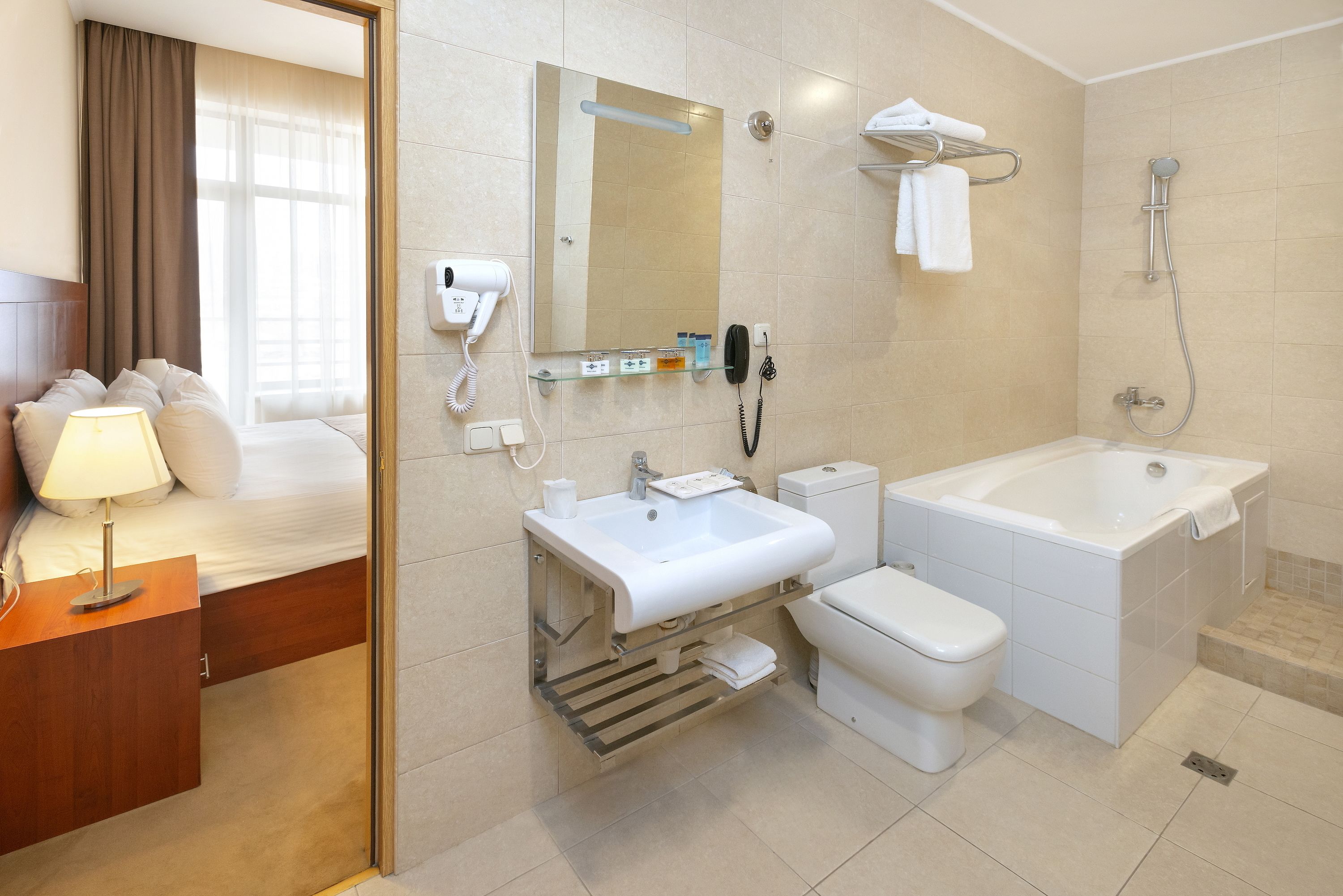 executive suite | bathroom | free toiletries, hair dryer, slippers, towels