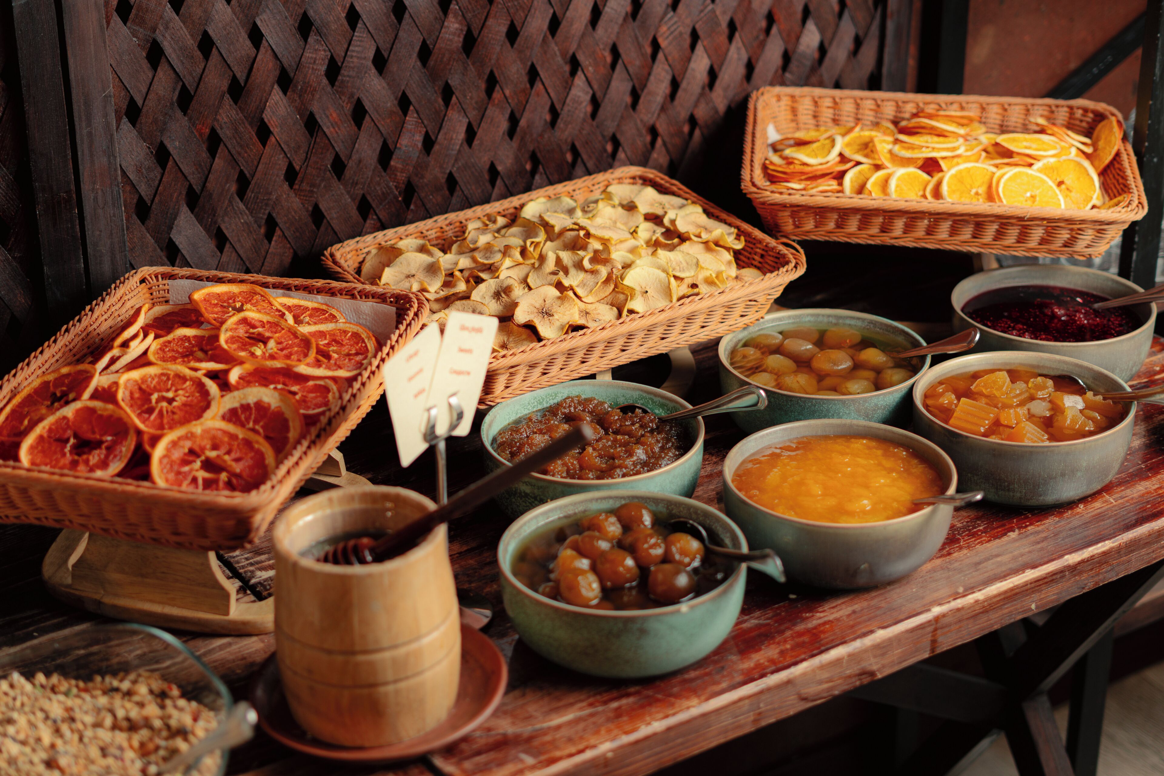 A buffet table with various food items and containers.