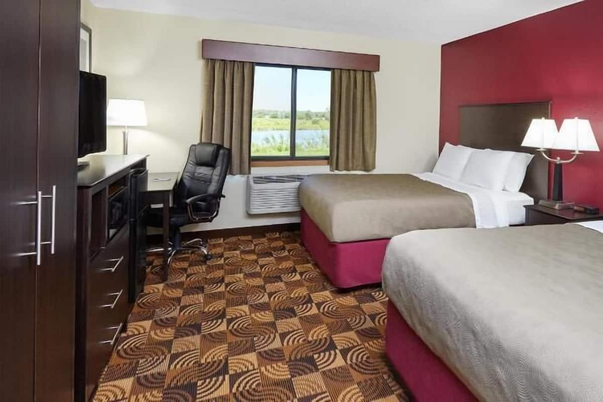 Desk, blackout drapes, iron/ironing board, free cribs/infant beds