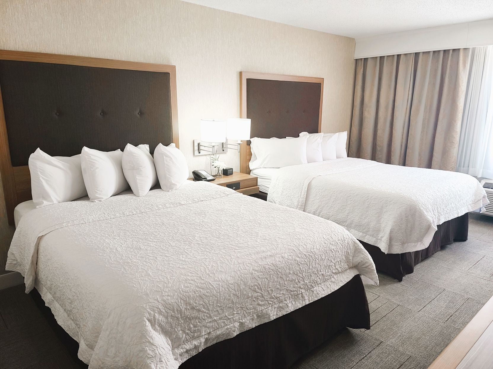 Premium bedding, pillow-top beds, desk, laptop workspace