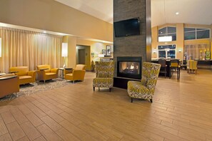Relax in our inviting lobby, featuring comfortable seating, a fireplace, and a flat-screen TV.