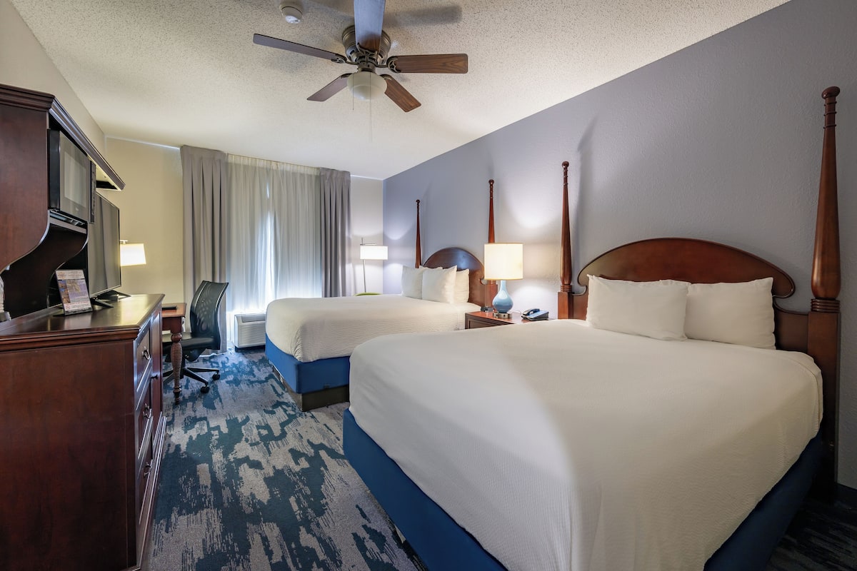 Premium bedding, desk, laptop workspace, blackout curtains
