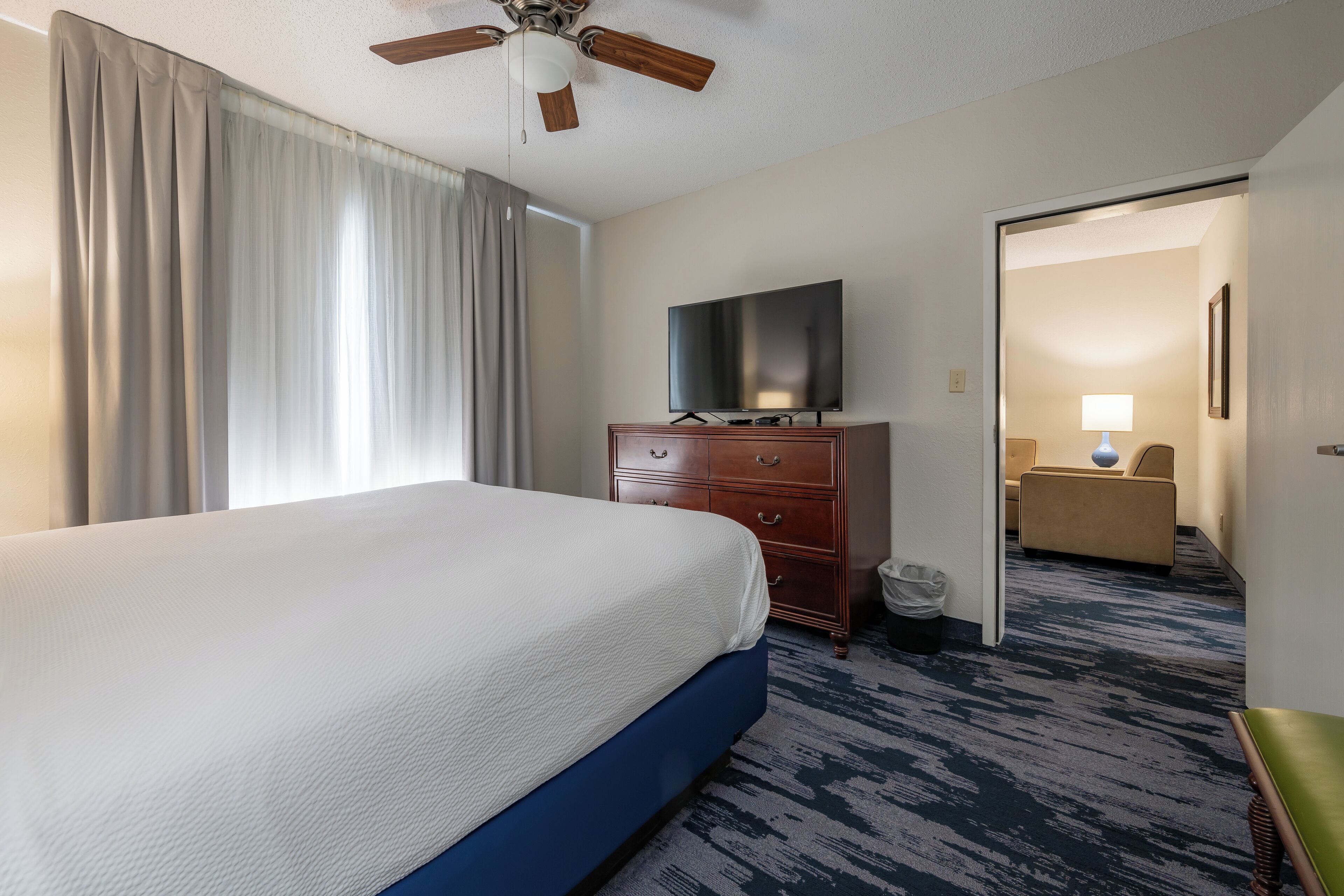 1 bedroom king suite with sofa bed | premium bedding, desk, laptop workspace, blackout curtains