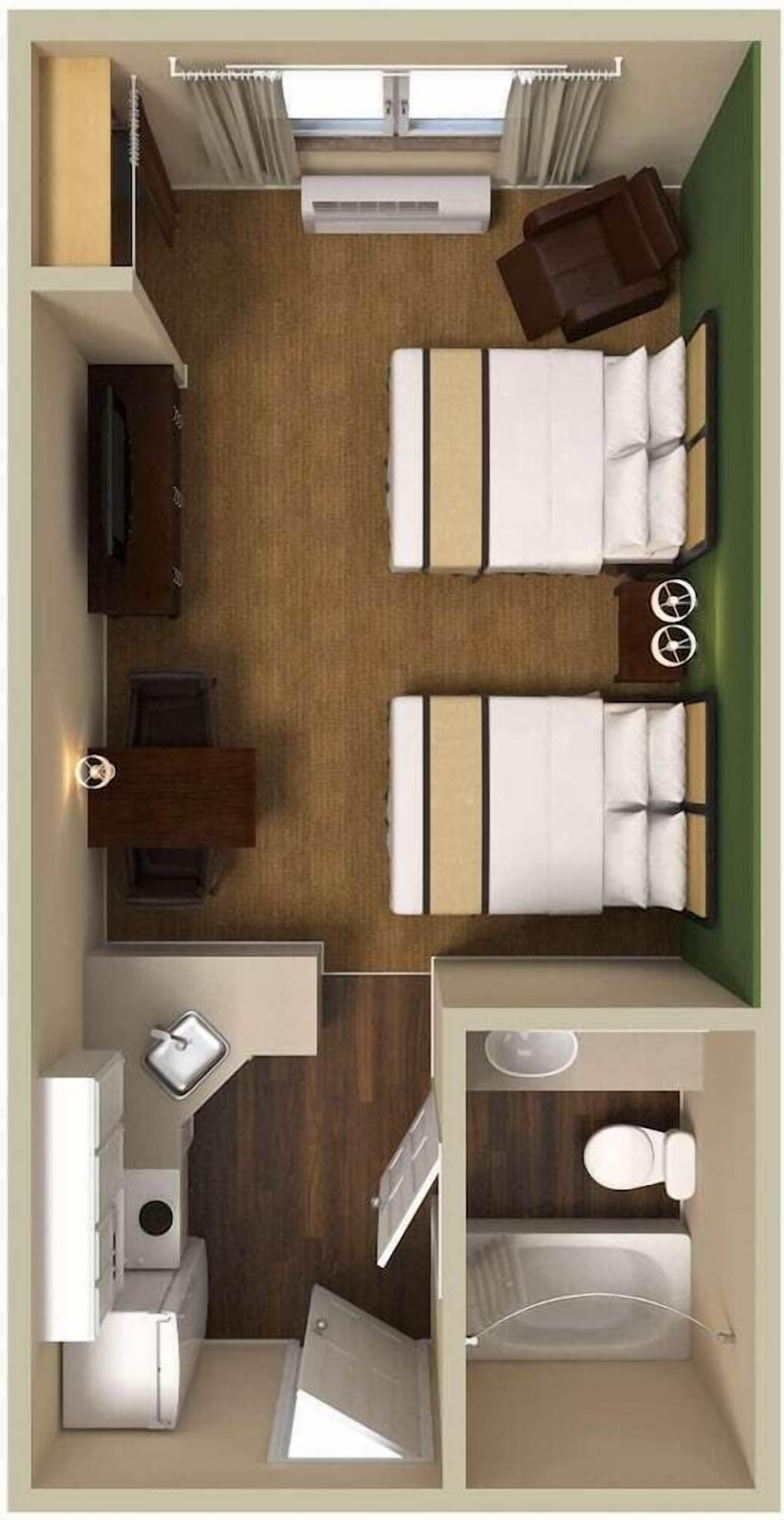 Habitación de hotel con dos camas, un escritorio, una silla, una mesita, un sofá, un televisor, un baño con inodoro y lavamanos, y una ventana con cortinas.