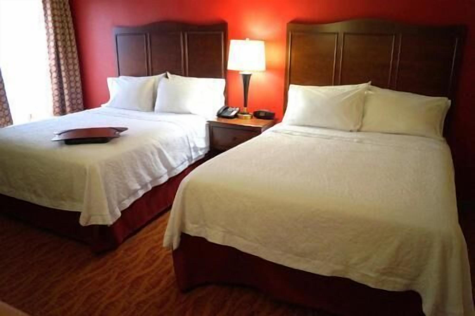 Hypo-allergenic bedding, desk, laptop workspace, blackout curtains