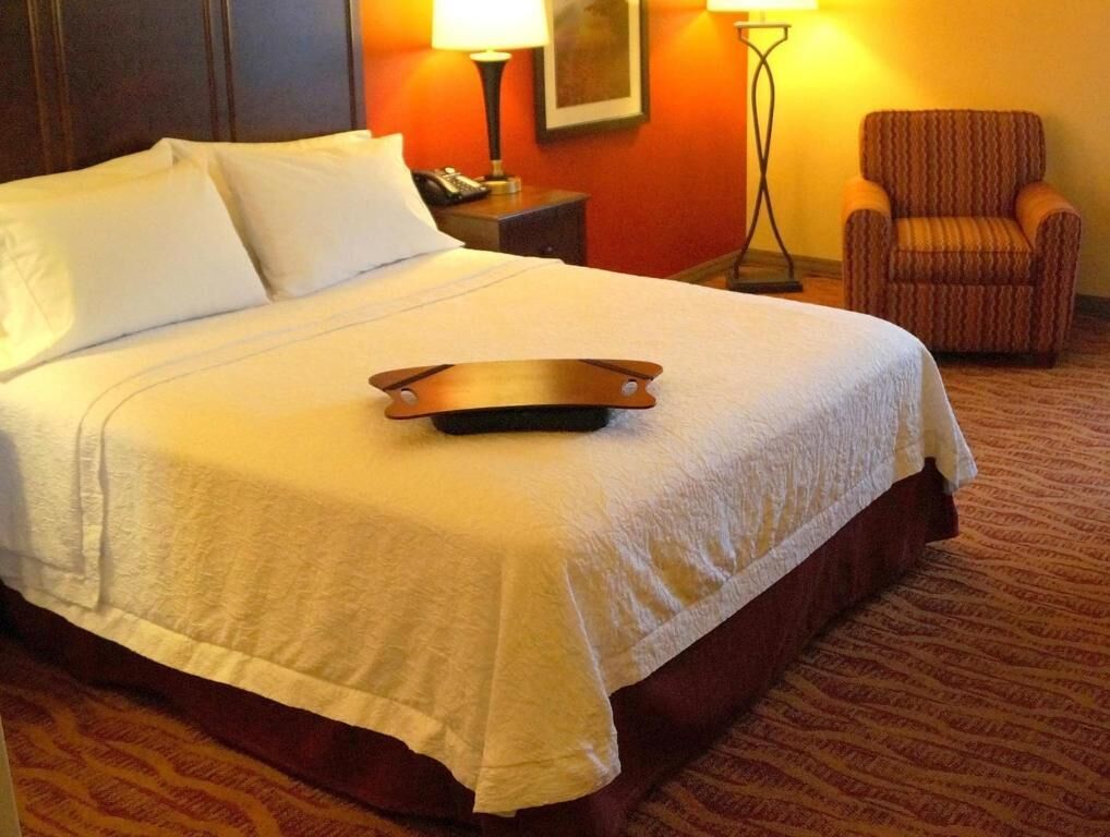 Hypo-allergenic bedding, desk, laptop workspace, blackout curtains