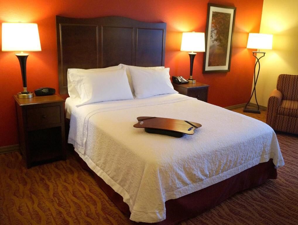Hypo-allergenic bedding, desk, laptop workspace, blackout curtains