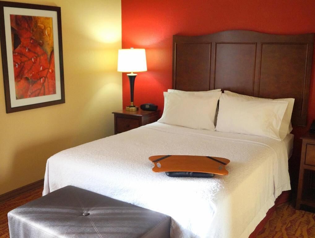 Hypo-allergenic bedding, desk, laptop workspace, blackout curtains