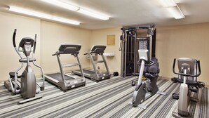 A fitness room with treadmills, an elliptical, and a weight machine. - MainStay Suites Kansas City Overland Park (Overland Park)