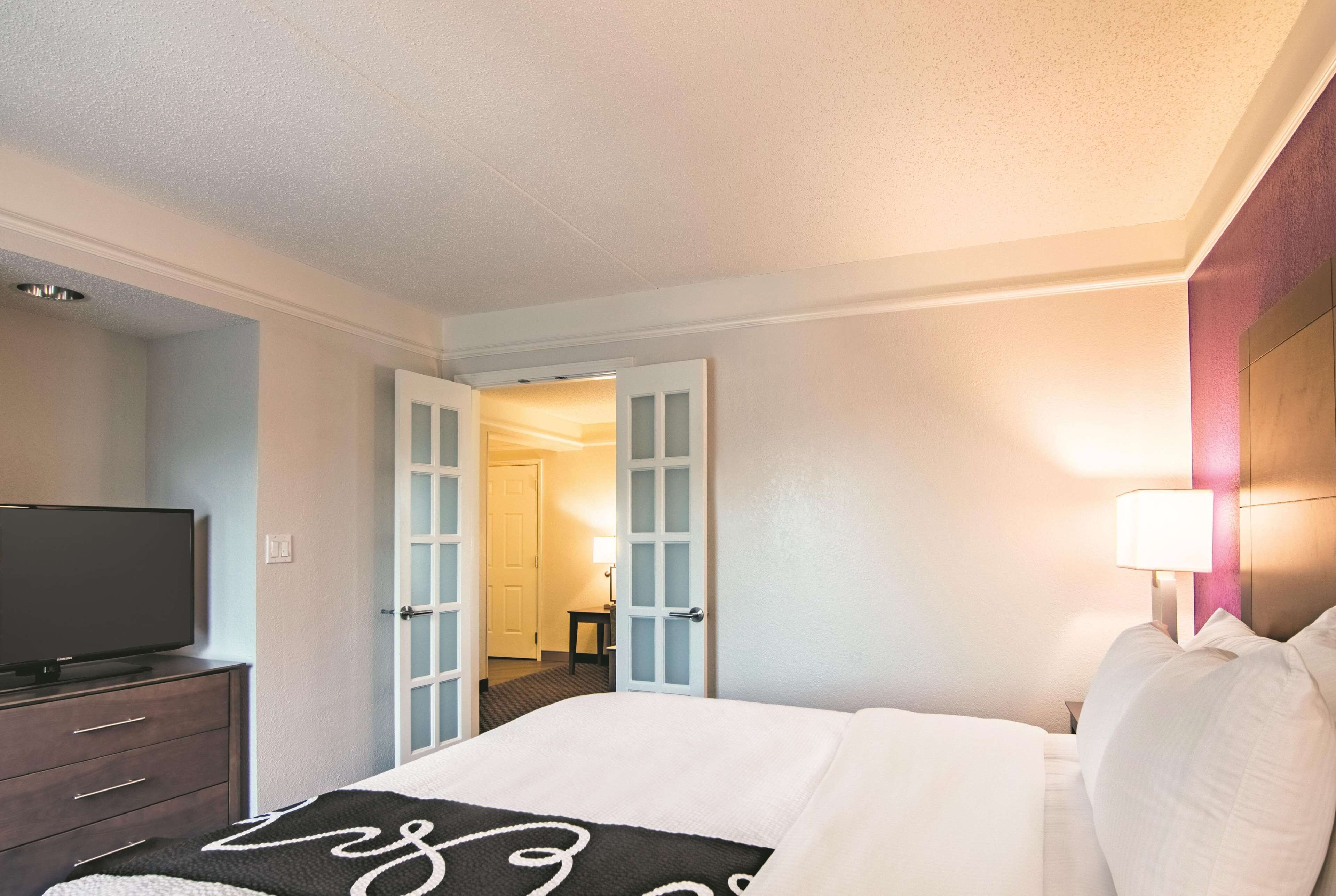 suite, 1 king bed, non smoking | premium bedding, desk, blackout curtains, iron/ironing board