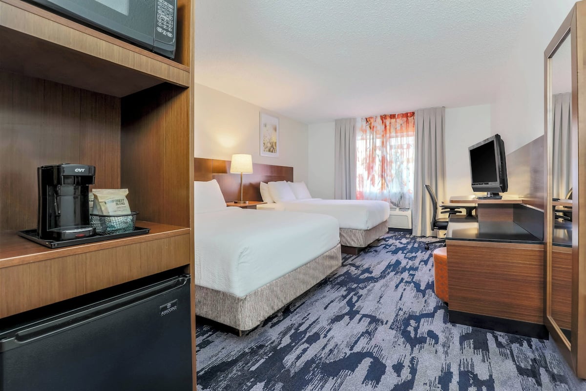 Premium bedding, desk, laptop workspace, blackout curtains