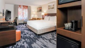 Premium bedding, desk, laptop workspace, blackout drapes