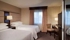 Premium bedding, down comforters, pillowtop beds, in-room safe