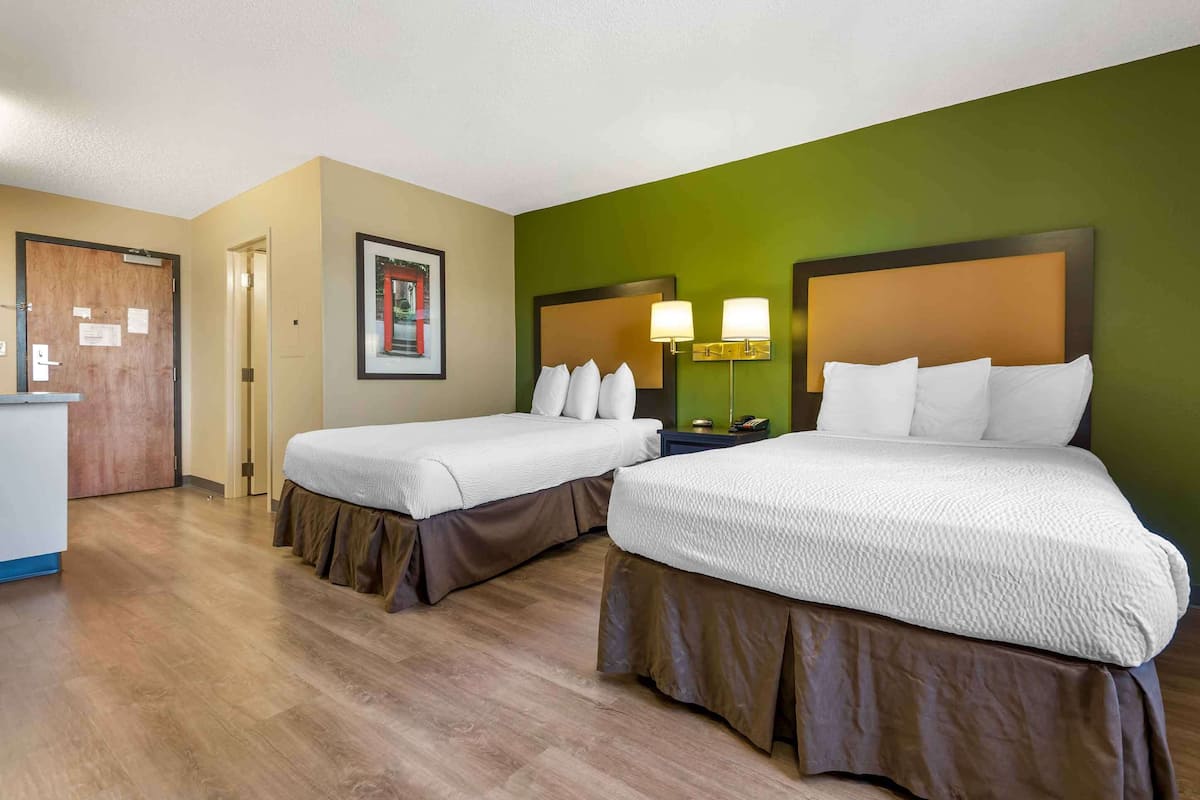 Desk, laptop workspace, blackout drapes, iron/ironing board