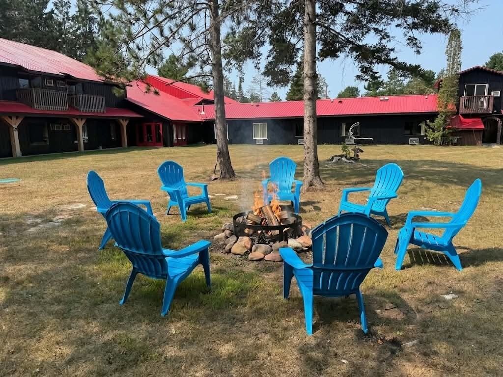 A fire pit with chairs arranged around it in an outdoor setting.
