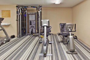 Stay fit on the go with our fully equipped gym featuring a treadmill, stationary bike, and weight machine.