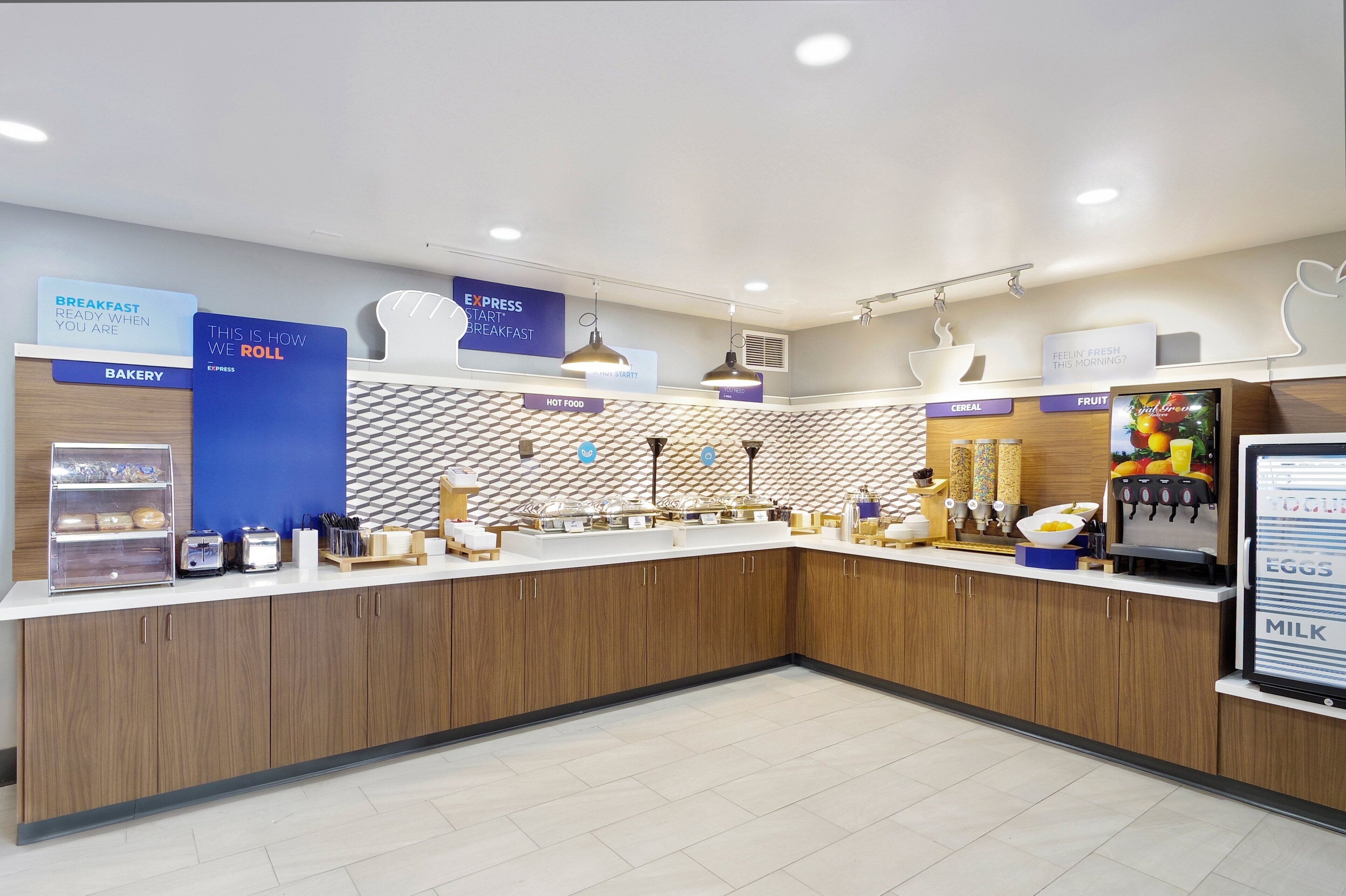 A modern breakfast area with bakery, express breakfast, hot food, and cereal options.
