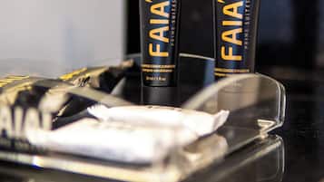 Two tubes of FaiAl shampoo conditioner on a tray.