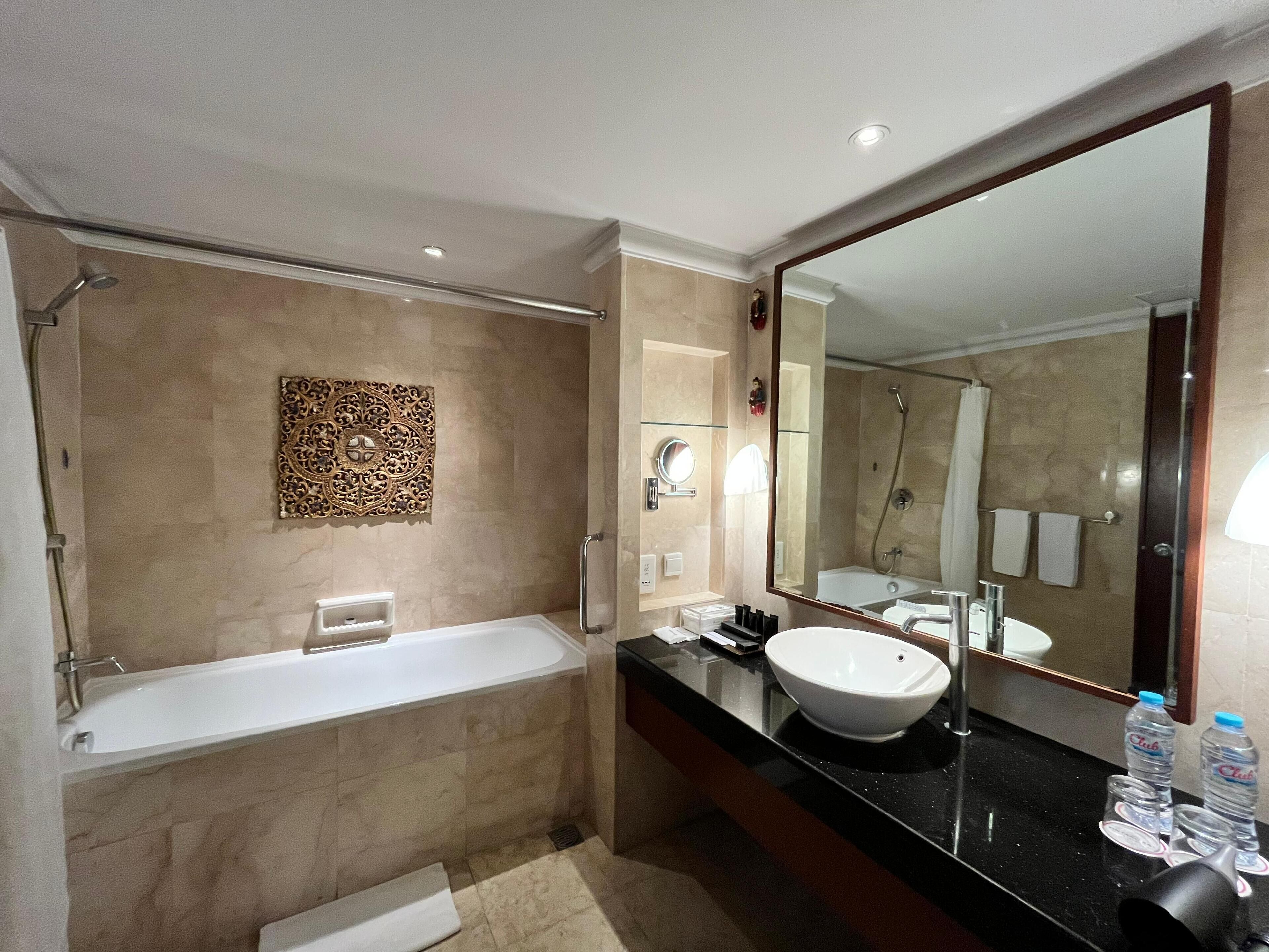 luxury two bedroom residence with pool view and partial ocean view | bathroom | hair dryer, slippers, bidet, towels