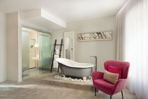 Junior Suite | Bathroom | Rainfall showerhead, designer toiletries, hair dryer, towels