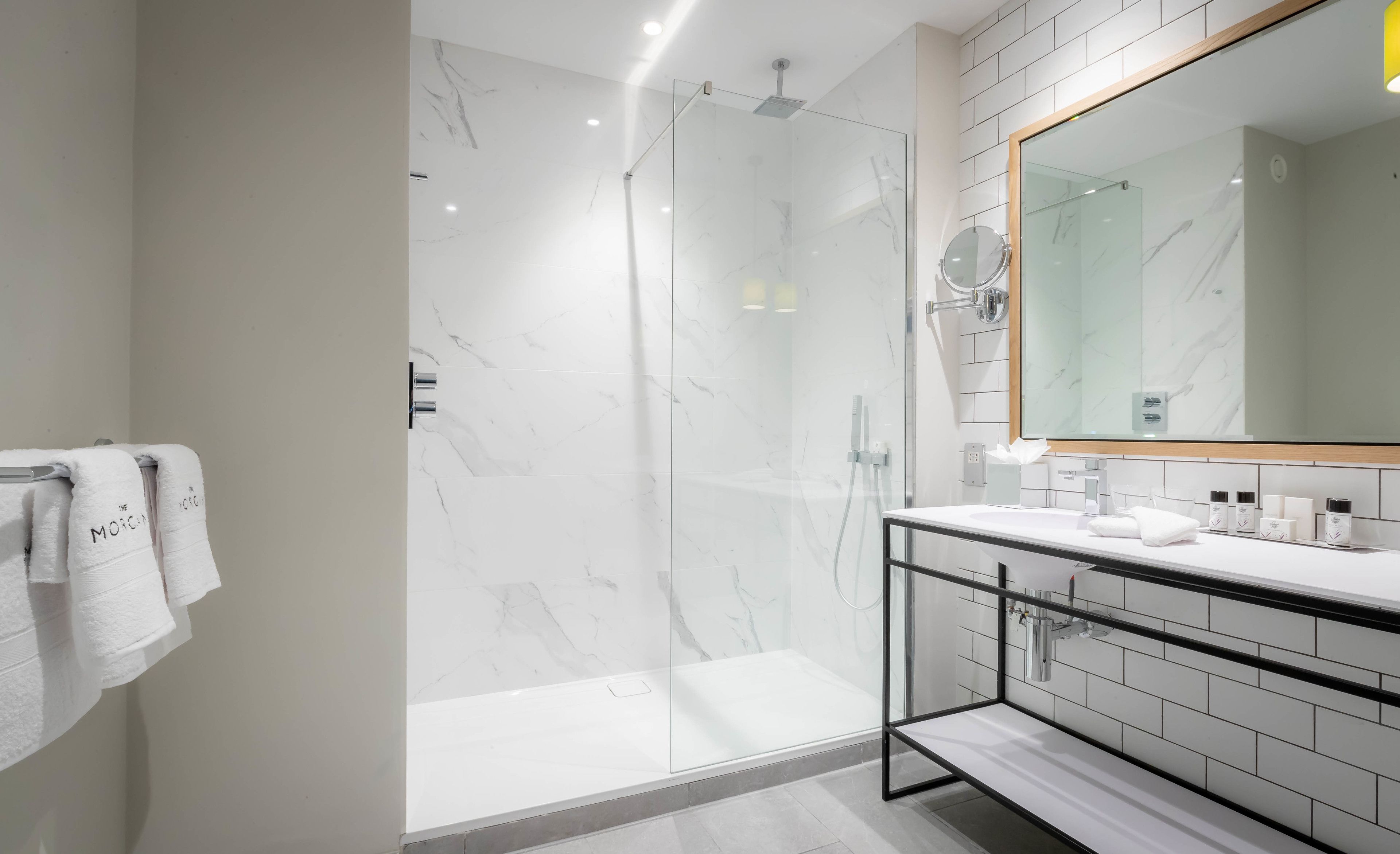 rainfall showerhead, designer toiletries, hair dryer, towels