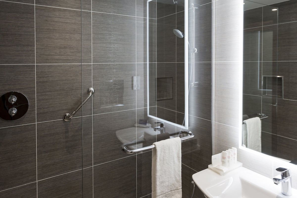 designer toiletries, hair dryer, towels, soap