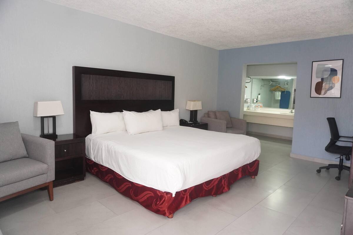 Suite, 1 King Bed, Non Smoking | Minibar, desk, blackout drapes, iron/ironing board (on request)